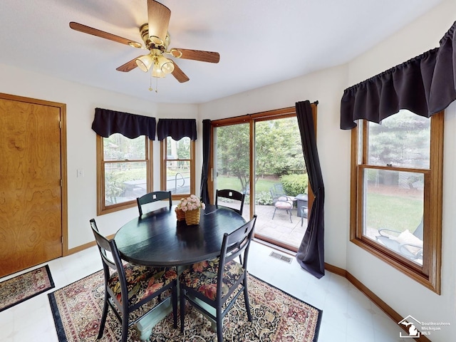 6757 Lockmill Rd, Temperance, MI 48182 - dining area with ceiling fan, baseboards, and light floors