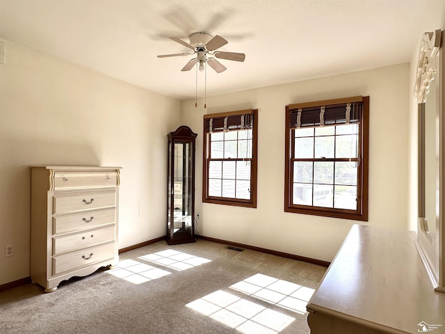 6757 Lockmill Rd, Temperance, MI 48182 - unfurnished bedroom featuring light carpet, baseboards, and ceiling fan
