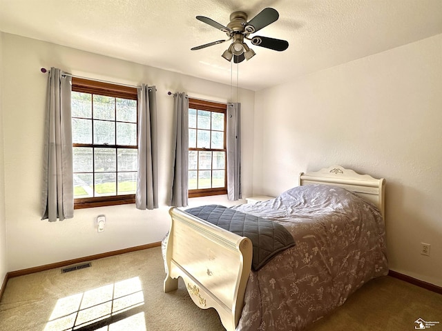 6757 Lockmill Rd, Temperance, MI 48182 - bedroom with baseboards, carpet floors, a textured ceiling, and ceiling fan