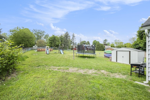 49 S Arthur St, Grant, MI 49327 - view of yard with a trampoline and a playground