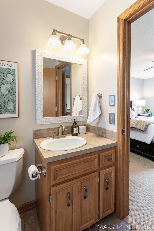 5540 Koster Dr SW, Wyoming, MI 49418 - bathroom with toilet, vanity, and ensuite bath