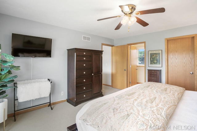 5540 Koster Dr SW, Wyoming, MI 49418 - bedroom with baseboards, light carpet, and ceiling fan