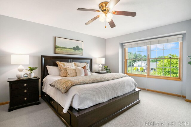 5540 Koster Dr SW, Wyoming, MI 49418 - bedroom featuring baseboards, light carpet, and ceiling fan
