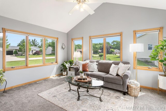 5540 Koster Dr SW, Wyoming, MI 49418 - carpeted living room with baseboards, ceiling fan, and high vaulted ceiling
