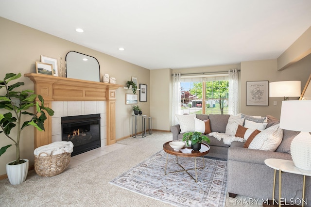 5540 Koster Dr SW, Wyoming, MI 49418 - living room featuring light colored carpet, a tiled fireplace, recessed lighting, and baseboards