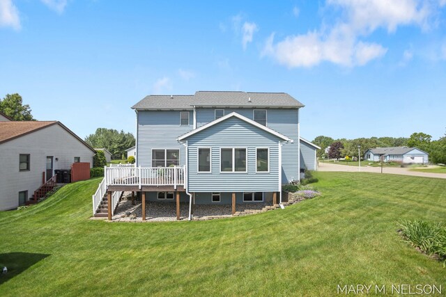 5540 Koster Dr SW, Wyoming, MI 49418 - rear view of house featuring a deck, stairs, and a yard