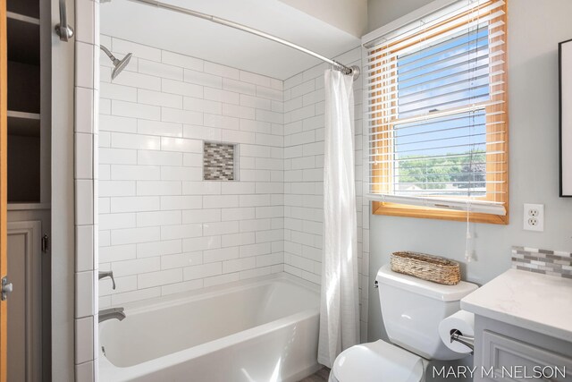 5540 Koster Dr SW, Wyoming, MI 49418 - bathroom with shower / tub combo, vanity, and toilet