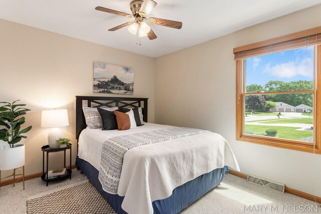 5540 Koster Dr SW, Wyoming, MI 49418 - carpeted bedroom with baseboards and a ceiling fan