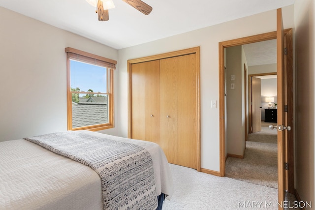 5540 Koster Dr SW, Wyoming, MI 49418 - carpeted bedroom featuring a closet, baseboards, and a ceiling fan