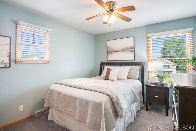 5540 Koster Dr SW, Wyoming, MI 49418 - bedroom with light colored carpet, baseboards, and a ceiling fan