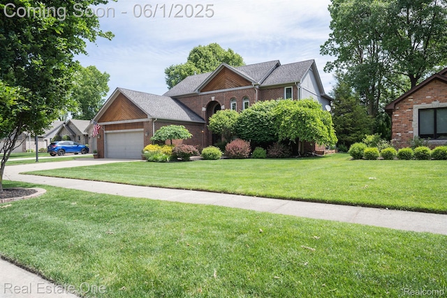 39888 Brylor, Clinton Township, MI 48038 - view of front of house with brick siding, a front lawn, an attached garage, concrete driveway, and a shingled roof