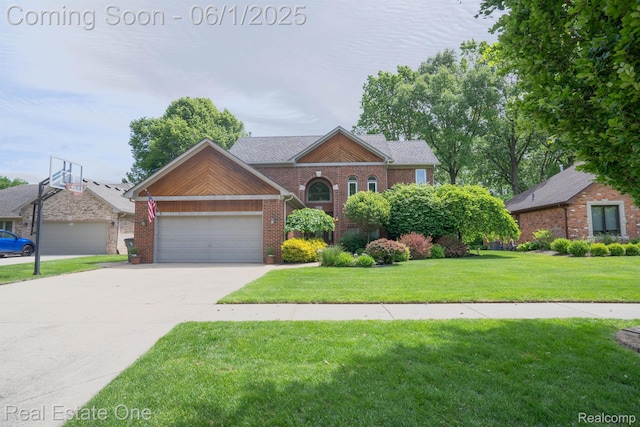 39888 Brylor, Clinton Township, MI 48038 - view of front facade with a front lawn, brick siding, concrete driveway, and a garage