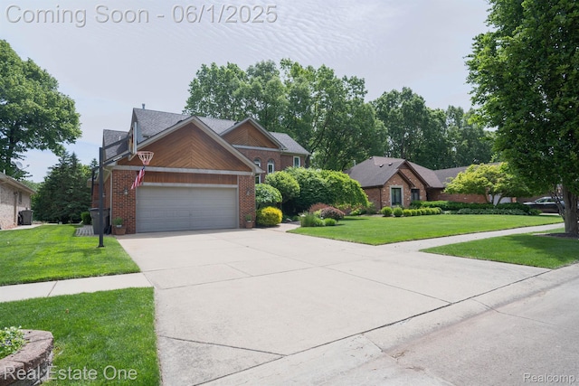 39888 Brylor, Clinton Township, MI 48038 - traditional-style house featuring brick siding, a front yard, driveway, and an attached garage