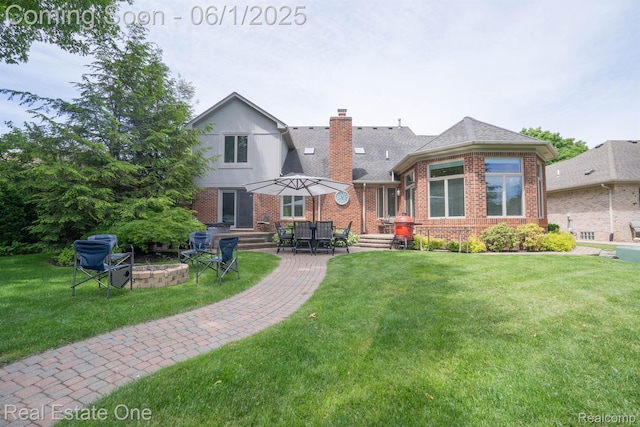 39888 Brylor, Clinton Township, MI 48038 - rear view of property with brick siding, a lawn, a chimney, an outdoor fire pit, and a patio