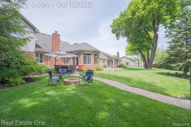 39888 Brylor, Clinton Township, MI 48038 - view of grassy yard with a fire pit