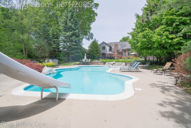 39888 Brylor, Clinton Township, MI 48038 - view of swimming pool featuring a water slide and a patio