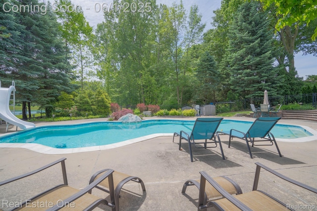 39888 Brylor, Clinton Township, MI 48038 - view of pool with a water slide, a patio, and view of scattered trees