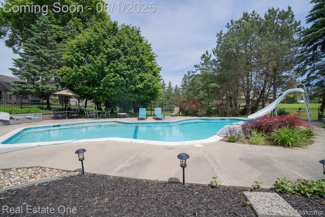 39888 Brylor, Clinton Township, MI 48038 - view of pool featuring a water slide and a patio