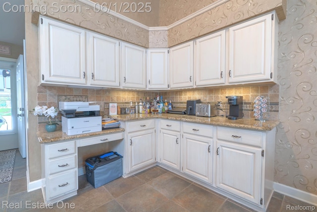 39888 Brylor, Clinton Township, MI 48038 - kitchen with white cabinets, tasteful backsplash, light stone countertops, and baseboards