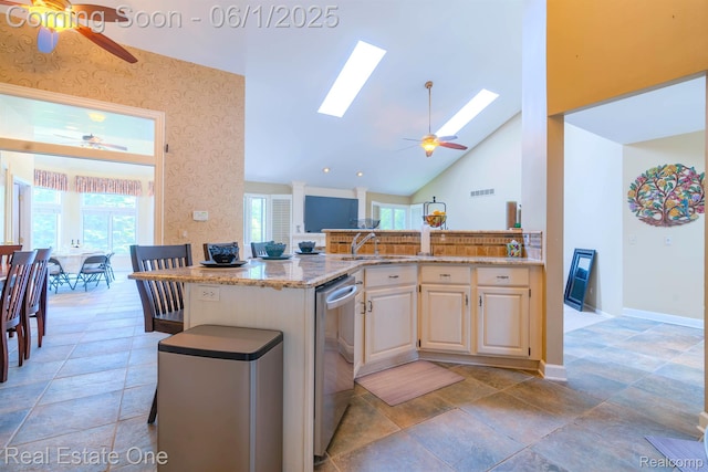 39888 Brylor, Clinton Township, MI 48038 - kitchen featuring a ceiling fan, stainless steel dishwasher, light stone countertops, healthy amount of natural light, and high vaulted ceiling