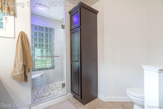 39888 Brylor, Clinton Township, MI 48038 - bathroom with a shower stall, baseboards, toilet, and tile patterned floors