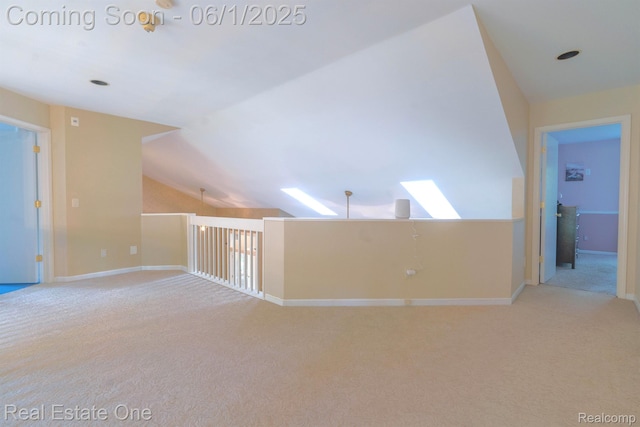 39888 Brylor, Clinton Township, MI 48038 - spare room with carpet flooring, lofted ceiling, baseboards, and a skylight