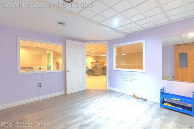 39888 Brylor, Clinton Township, MI 48038 - unfurnished living room featuring baseboards and wood finished floors