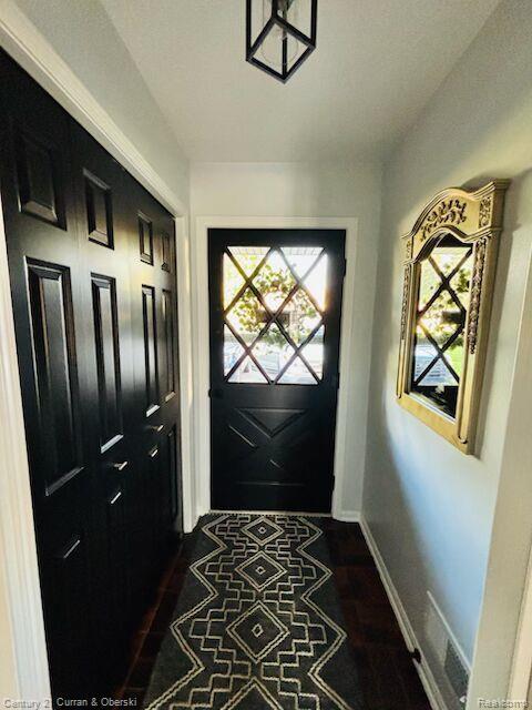 45215 Custer Ave, Utica, MI 48317 - doorway to outside with baseboards