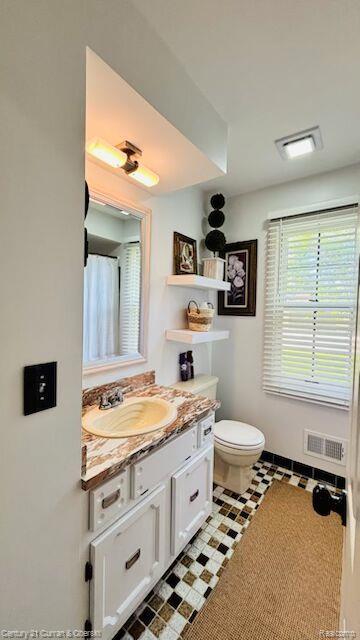 45215 Custer Ave, Utica, MI 48317 - bathroom featuring vanity and toilet