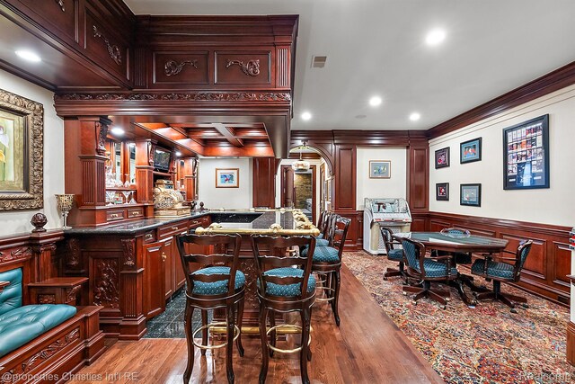 975 Sunningdale Dr, Bloomfield Hills, MI 48302 - bar featuring crown molding, dark wood-type flooring, a decorative wall, wainscoting, and recessed lighting