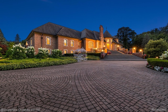 975 Sunningdale Dr, Bloomfield Hills, MI 48302 - view of front of property with brick siding, a high end roof, and a chimney