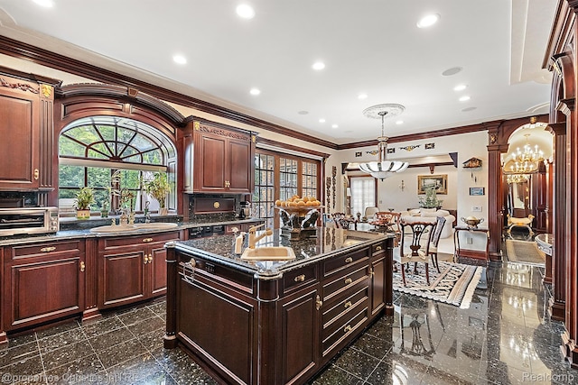 975 Sunningdale Dr, Bloomfield Hills, MI 48302 - kitchen with a chandelier, granite tiled floors, crown molding, healthy amount of natural light, and a kitchen island