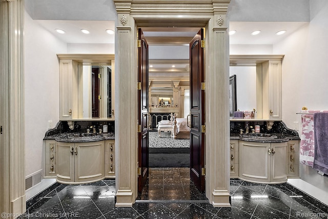 975 Sunningdale Dr, Bloomfield Hills, MI 48302 - ensuite bathroom featuring granite tiled floors, baseboards, two vanities, decorative backsplash, and recessed lighting