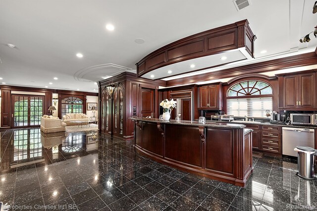 975 Sunningdale Dr, Bloomfield Hills, MI 48302 - kitchen featuring appliances with stainless steel finishes, granite floors, crown molding, plenty of natural light, and dark countertops