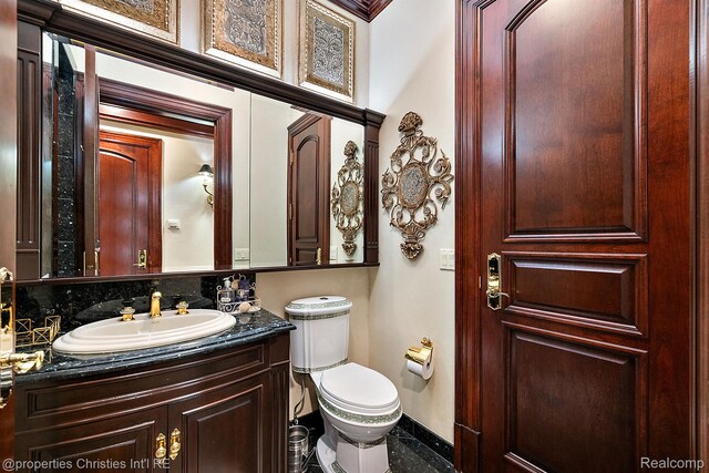 975 Sunningdale Dr, Bloomfield Hills, MI 48302 - bathroom featuring vanity, baseboards, and toilet