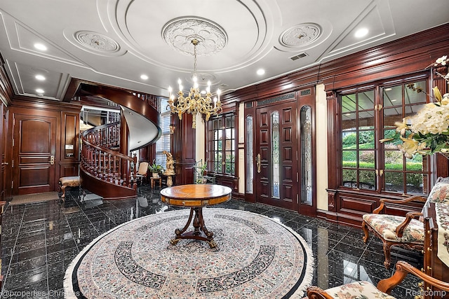 975 Sunningdale Dr, Bloomfield Hills, MI 48302 - foyer entrance with granite tiled floors, ornamental molding, a chandelier, stairs, and ornate columns