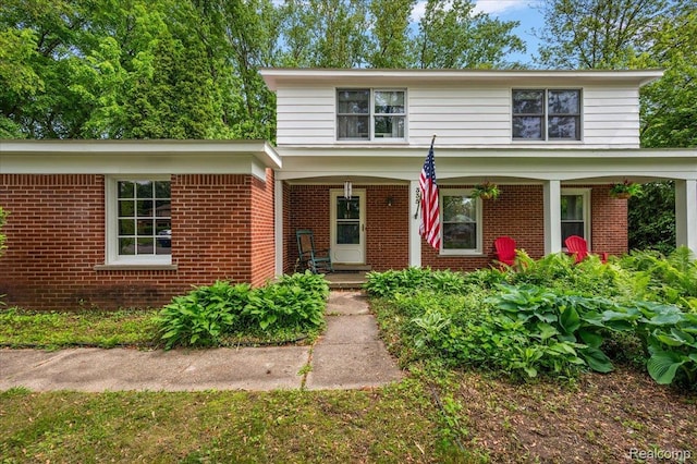 335 Douglas Dr, Bloomfield Hills, MI 48304 - traditional-style house with brick siding and a porch