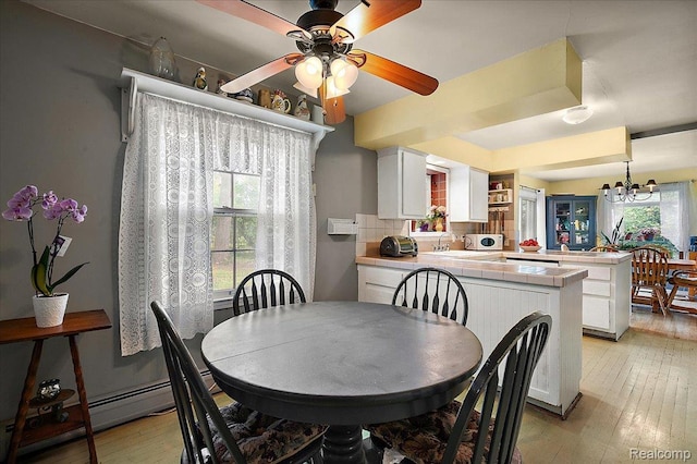 335 Douglas Dr, Bloomfield Hills, MI 48304 - dining area featuring plenty of natural light, ceiling fan, light wood-style floors, and a chandelier