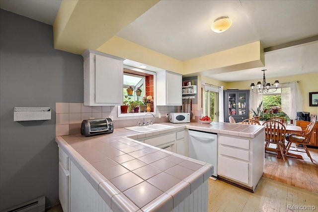335 Douglas Dr, Bloomfield Hills, MI 48304 - kitchen with white appliances, tile countertops, a baseboard heating unit, a peninsula, and a sink