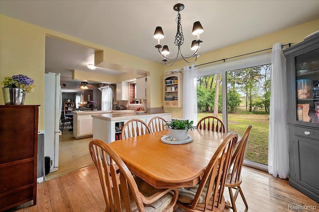 335 Douglas Dr, Bloomfield Hills, MI 48304 - dining area featuring light wood finished floors, ceiling fan, and a chandelier