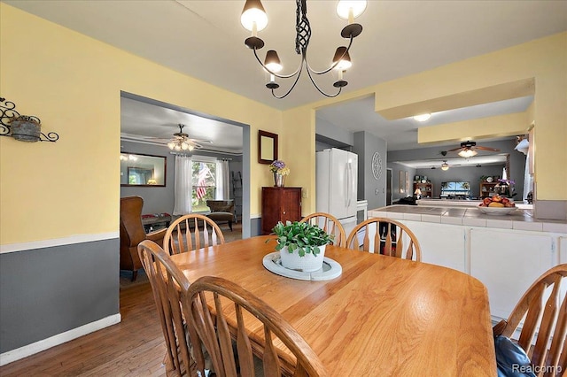 335 Douglas Dr, Bloomfield Hills, MI 48304 - dining room featuring ceiling fan, wood finished floors, a chandelier, and baseboards
