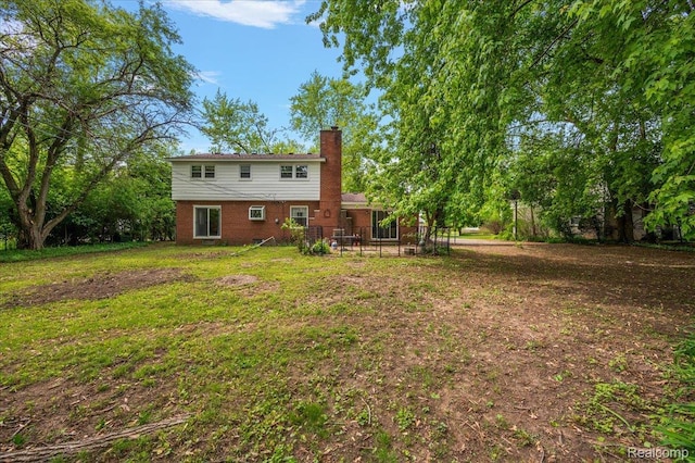 335 Douglas Dr, Bloomfield Hills, MI 48304 - rear view of property with a chimney, a yard, a patio, and brick siding