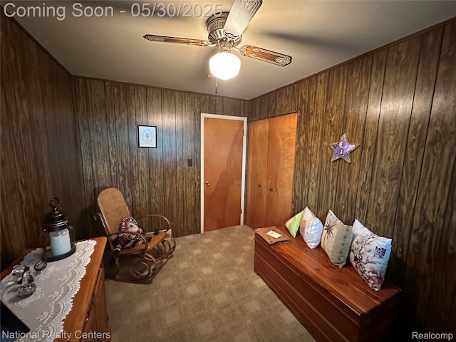 35951 Dover St, Livonia, MI 48150 - living area with carpet flooring, a ceiling fan, and wooden walls