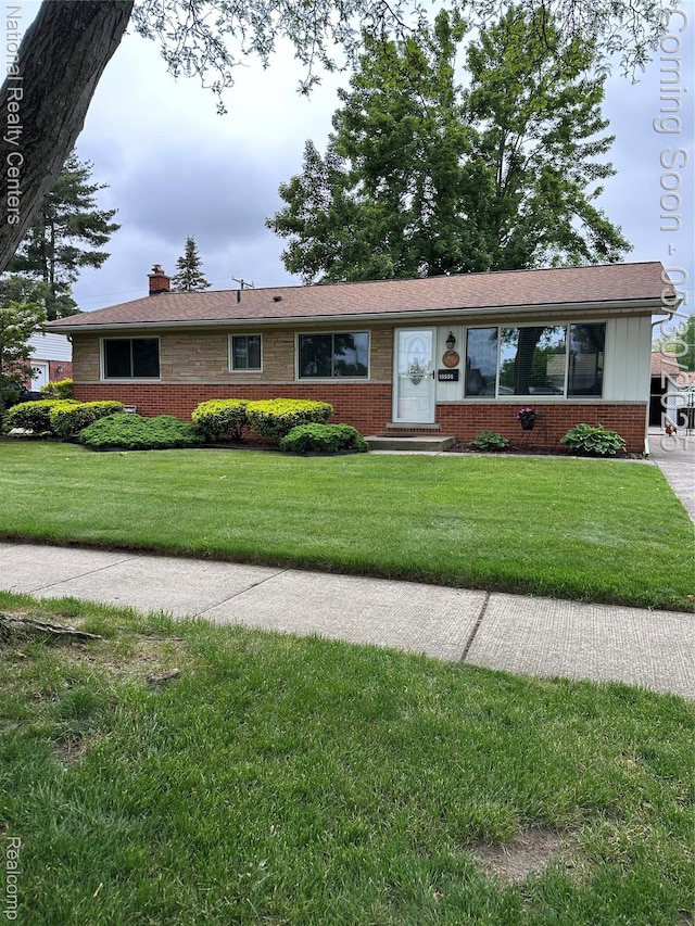 35951 Dover St, Livonia, MI 48150 - ranch-style house with brick siding, a chimney, a front yard, and entry steps