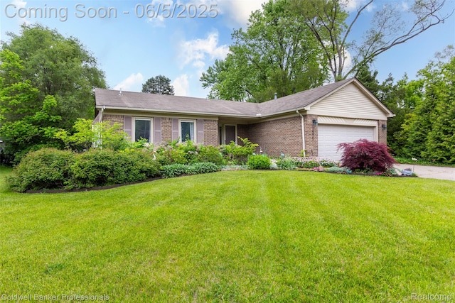 1975 Chancery Dr, Troy, MI 48085 - view of front of property with brick siding, a garage, a front lawn, and driveway