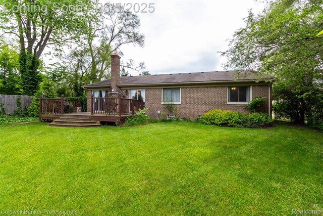 1975 Chancery Dr, Troy, MI 48085 - rear view of house with a chimney, a wooden deck, and brick siding