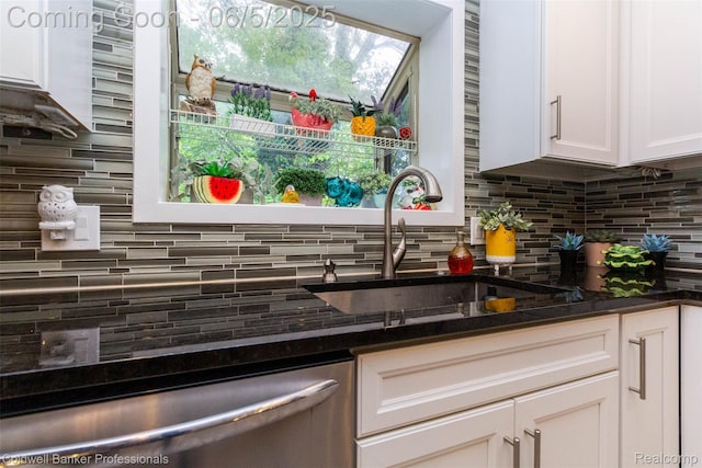 1975 Chancery Dr, Troy, MI 48085 - kitchen featuring stainless steel dishwasher, tasteful backsplash, white cabinetry, a sink, and dark stone counters