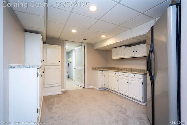 1975 Chancery Dr, Troy, MI 48085 - kitchen featuring freestanding refrigerator, light colored carpet, white cabinets, light countertops, and recessed lighting