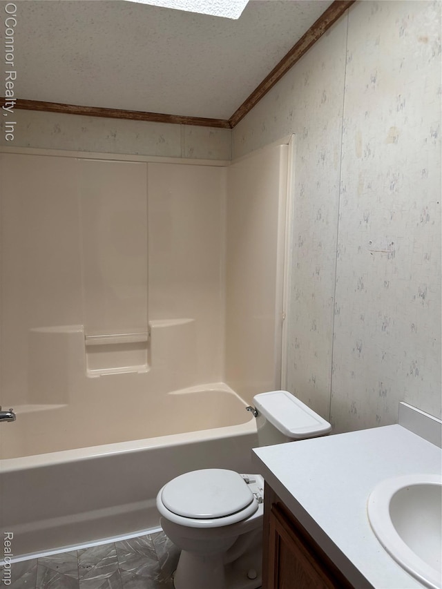 504 Bush Lake Ln, Smiths Creek, MI 48074 - full bath featuring lofted ceiling, vanity, ornamental molding, toilet, and shower / tub combination
