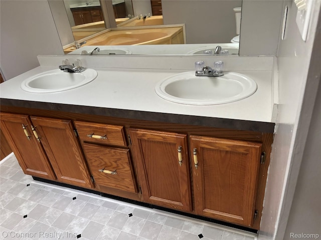 504 Bush Lake Ln, Smiths Creek, MI 48074 - bathroom featuring double vanity and toilet